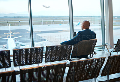 Buy stock photo Waiting, airport and black man on a phone rest for travel, plane and air flight. Businessman, mobile connection and person sitting with cellphone looking at traveler app info for airplane traveling
