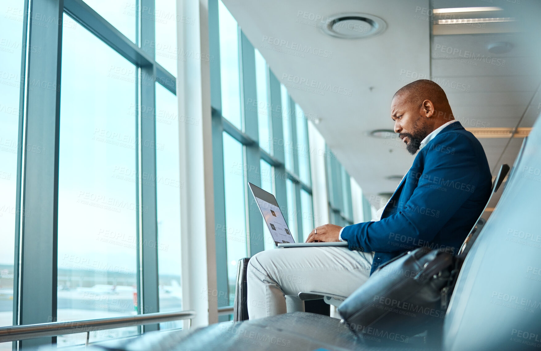 Buy stock photo Travel, laptop and website with black man in airport for online booking, vip lounge and communication. Relax, internet and technology with businessman reading on layover for vacation, trip and flight