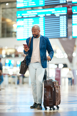 Buy stock photo Black man with phone, luggage and checking flight schedule online, waiting in terminal for international business trip. Internet, travel app and businessman at airport for international destination.