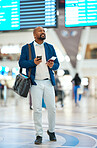 Black man checking flight schedule with phone and ticket walking in airport terminal, holding passport for business trip. Smile, travel app and happy businessman boarding international destination.