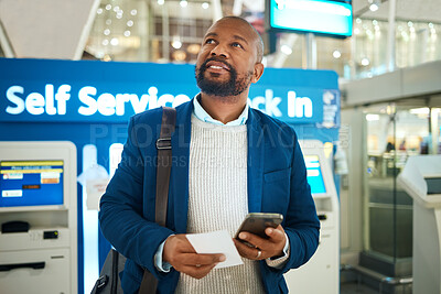 Buy stock photo Travel, black man with phone at airport and self service check in, standing in terminal and holding ticket for business trip. Smile, app and businessman checking international flight schedule online.