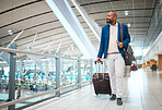 Travel, airport and luggage with a business black man walking in a terminal for global success. Manager, mockup and flight with a male ceo in a terminus station for international work traveling
