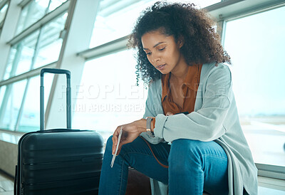 Buy stock photo Airport, black woman and watch time check of a young female at plane terminal with flight delay. Waiting, sitting and person with passport document looking at smartwatch for board and transport info