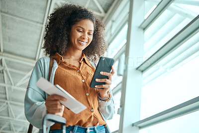 Buy stock photo Black woman at airport, travel with smartphone and plane ticket, communication and check social media with smile. Notification, email or chat with technology, ready for flight and happy for adventure