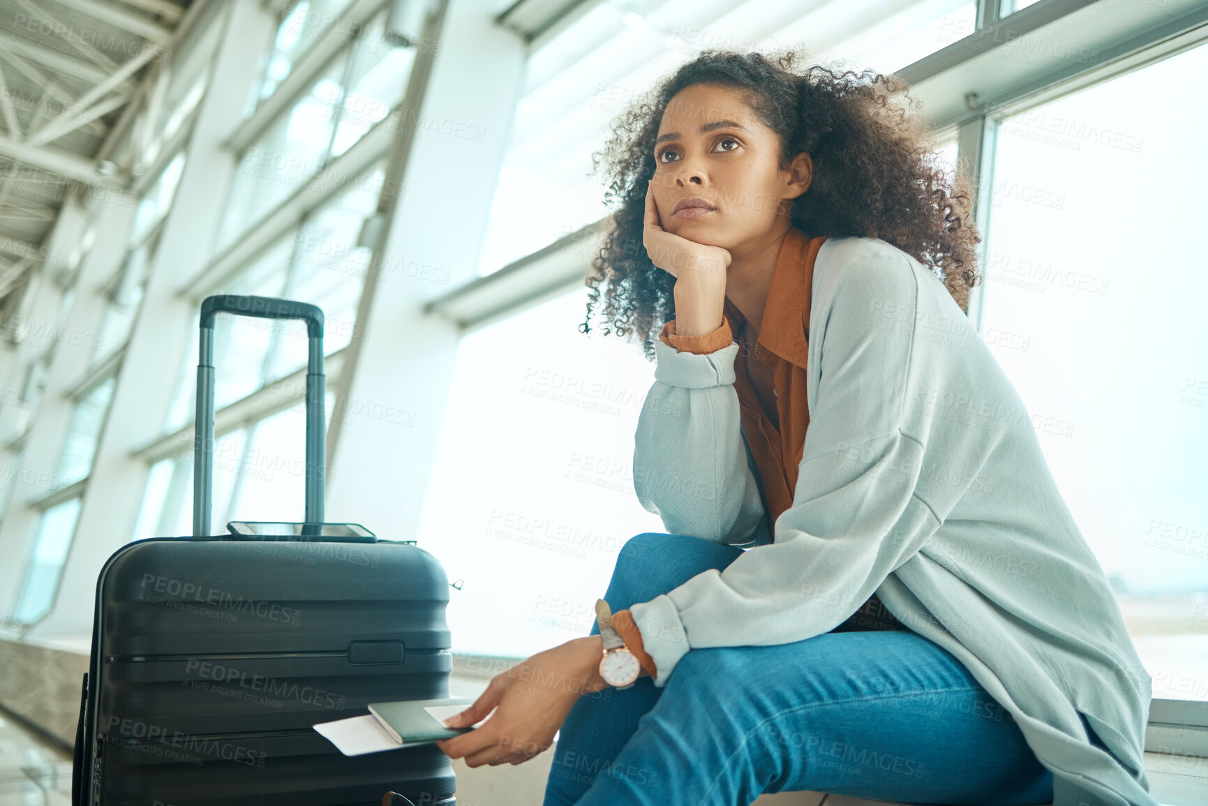 Buy stock photo Airport, travel delay and sad woman with anxiety for immigration, passport problem or schedule. Young USA person with luggage and stress, worry or thinking of flight fail, crisis or identity mistake