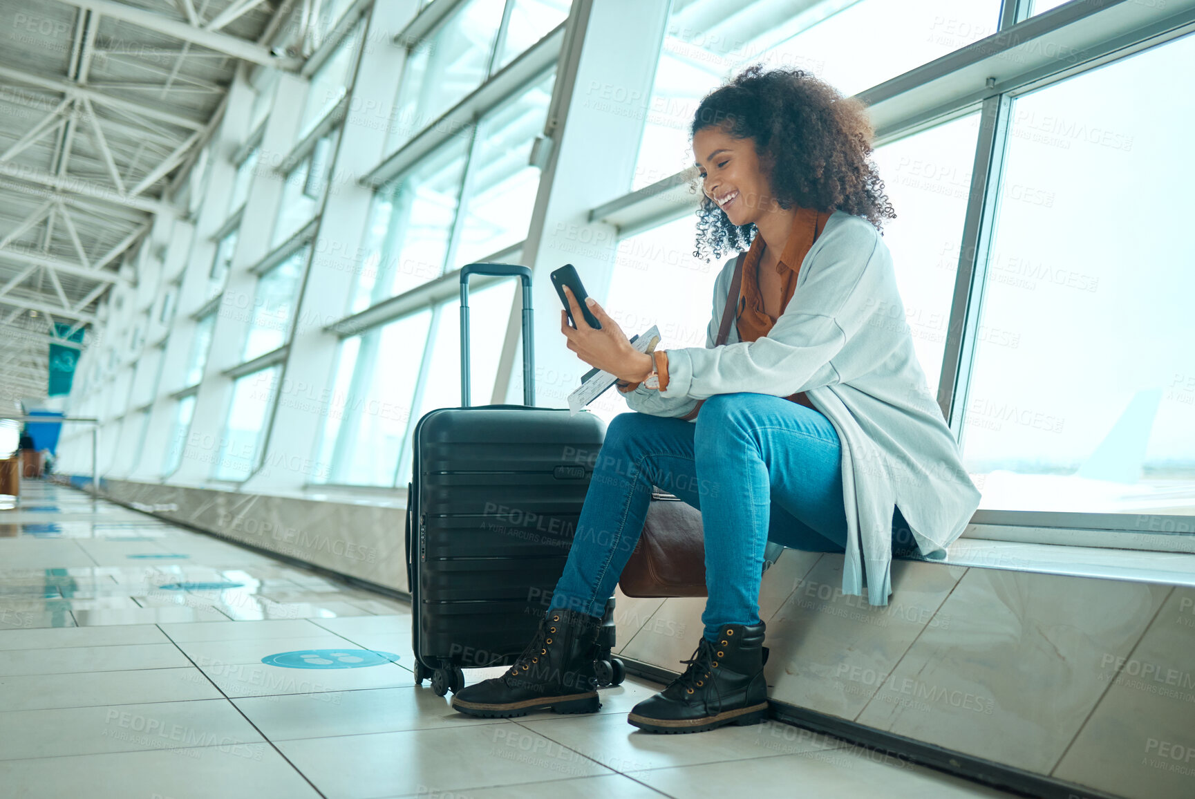 Buy stock photo Travel, phone and black woman at airport on a video call waiting for plane travel and flight. Online, mobile connection and smile of a young female sitting at airplane terminal waiting for transport