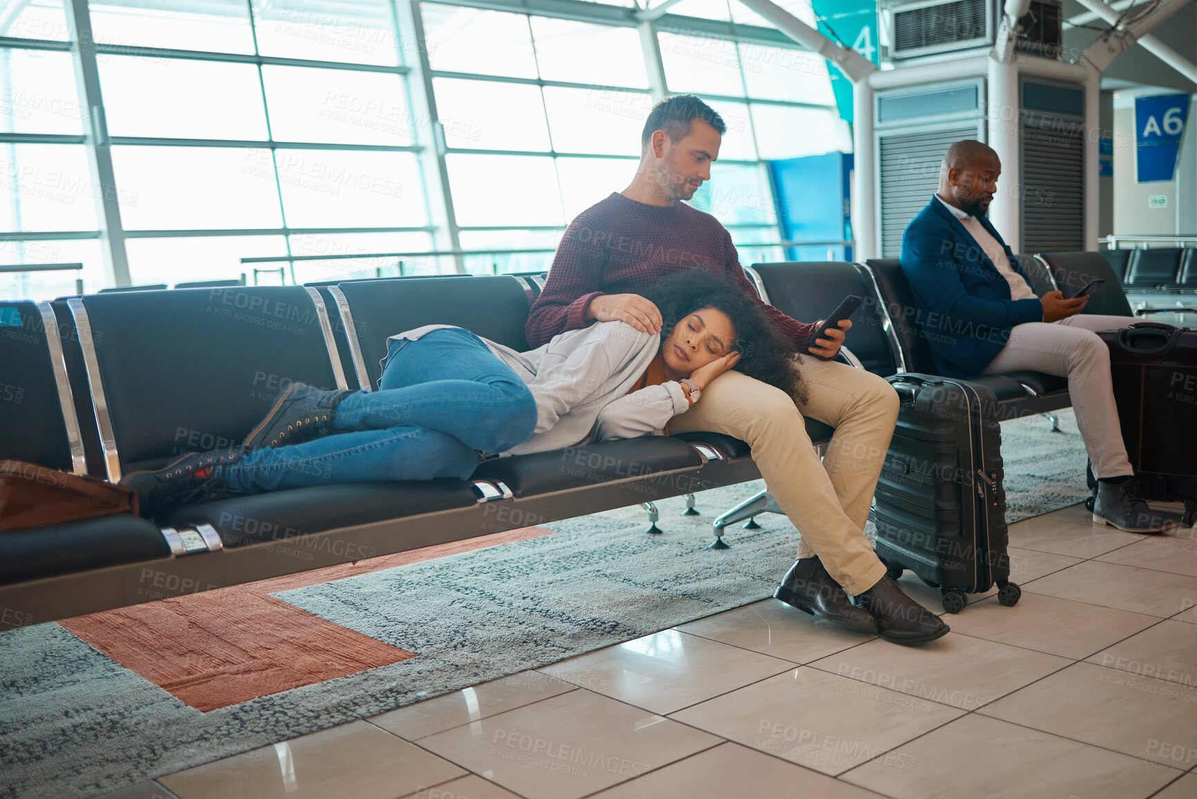 Buy stock photo Tired, delay and couple at the airport for a flight, waiting and sitting in the lounge on a phone. Immigration, relax and woman sleeping with a man reading on a mobile while traveling for holiday