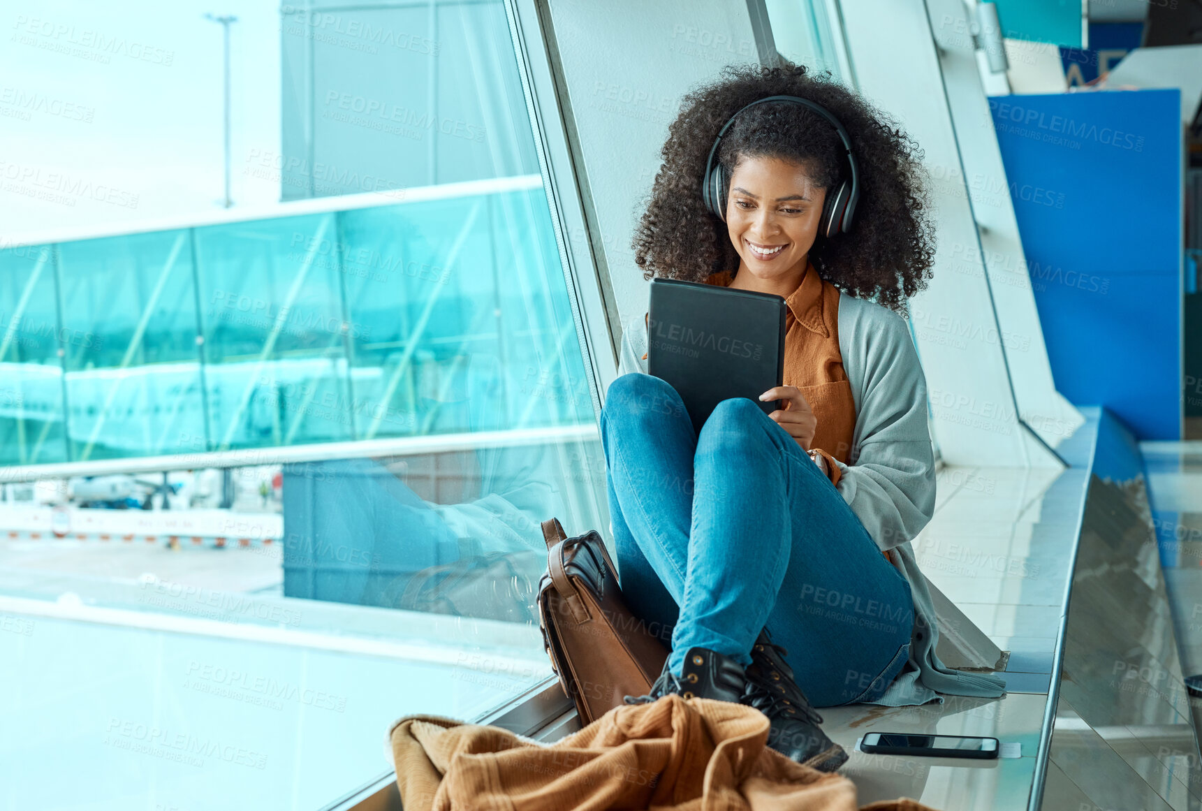 Buy stock photo Airport, travel and black woman with tablet by window waiting for flight, departure and transport. Immigration, lobby and girl with headphones on digital tech for internet, music and social media