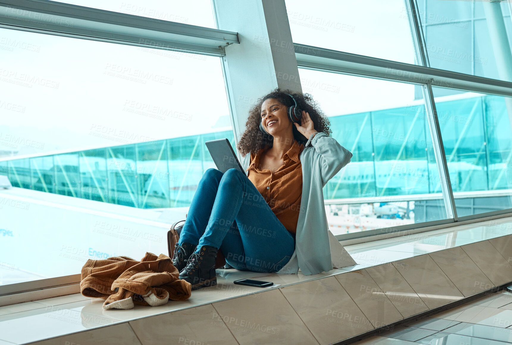 Buy stock photo Black woman, headphones and travel with tablet, airport and listening to music with business trip or holiday. Happy, flight and vacation with traveling, conference or convention with technology