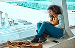 Airport, travel and black woman reading a book by window waiting for global flight, departure and transport. Immigration, travelling lobby and girl relax with headphones for music, podcast and audio