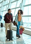 Travel, love and smile with interracial couple in airport for vacation, tourism and departure. International trip, luggage and holiday with man and black woman walking for flight, journey or airline