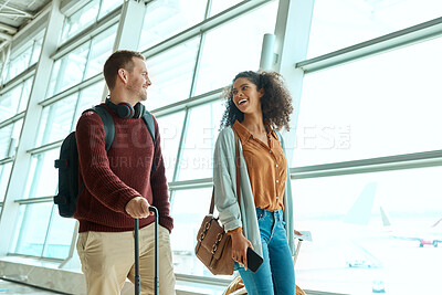 Buy stock photo Travel, love and smile with interracial couple in airport for vacation, tourism and departure. International trip, luggage and holiday with man and black woman walking for flight, journey or airline