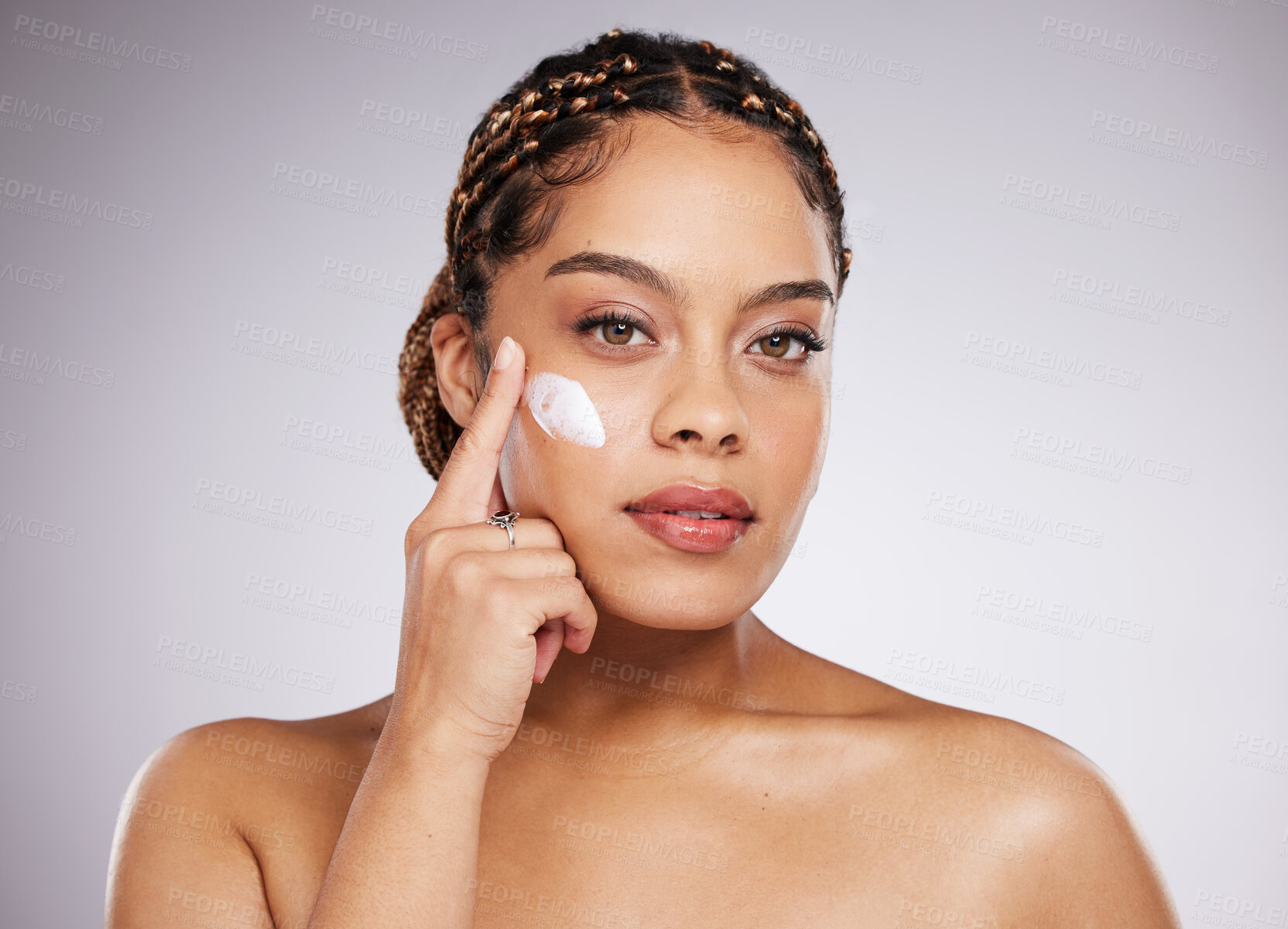 Buy stock photo Black woman, lotion and portrait of a young model with facial mask, moisturiser and wellness. Studio, beauty and female with dermatology, collagen and cosmetic face cream for skin glow and self care