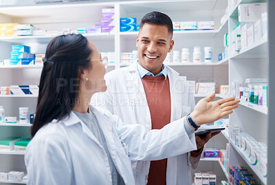 Buy stock photo Pharmacy, employees and discussion with healthcare, inventory for stock and teamwork. Pharmacist, man and woman talking, planning and prescriptions with happiness, staff and medical professionals