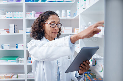 Buy stock photo Senior woman, tablet and pharmacist stock check in pharmacy for healthcare medicine in drugstore. Medication, technology and female medical doctor with touchscreen for checking inventory in shop.