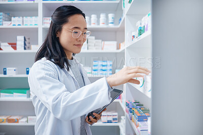 Buy stock photo Tablet, Asian woman and pharmacist stock check in pharmacy for healthcare medicine in drugstore. Medication, technology or young female medical doctor with touchscreen for checking inventory in shop.