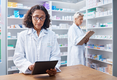 Buy stock photo Senior woman, tablet and pharmacist in pharmacy for healthcare, telehealth or stock check. Medicine shop, technology and female medical doctor with touchscreen for research or online consultation.