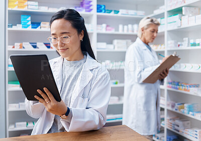 Buy stock photo Asian woman, tablet and pharmacist in pharmacy for healthcare, telehealth or stock check. Medicine shop, technology and female medical doctor with touchscreen for research or online consultation.