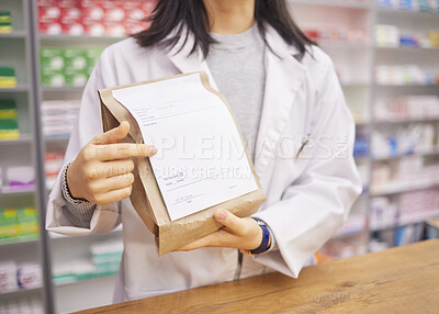 Prescription, medicine and hands of a pharmacist with a bag for health, medical pills and drugs. Retail, wellness and woman at a pharmacy for service, healthcare advice and showing information