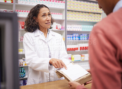 Buy stock photo Pharmacy, medicine and senior woman pharmacist talking to man about pills side effects. Reading, prescription info and healthcare worker working with customer service for health and wellness check