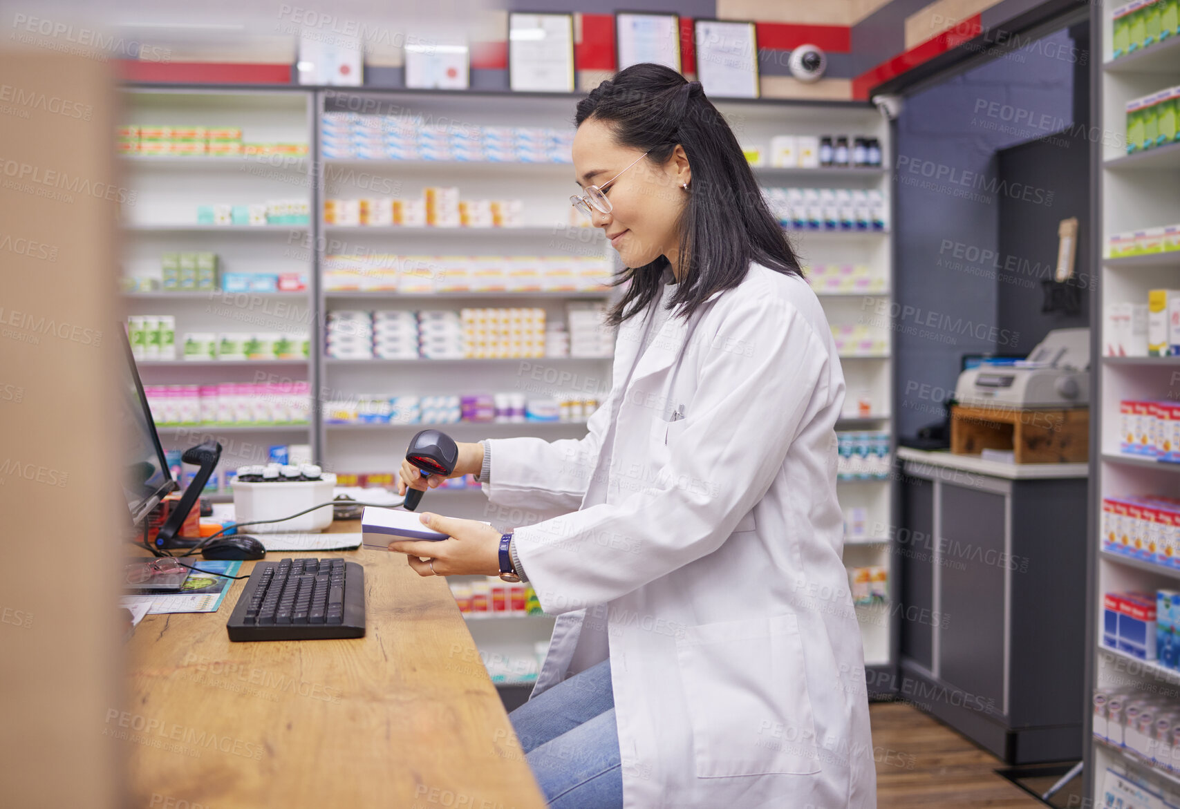 Buy stock photo Pharmacy, help and asian woman at checkout counter for prescription drugs scanning medicine. Healthcare, pills and pharmacist from Japan with medical product in box and digital scanner in drugstore.