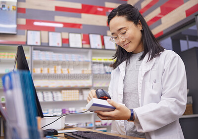 Buy stock photo Pharmacy, smile and asian woman scanning medicine at checkout counter for prescription drugs. Healthcare, pills and pharmacist from Japan with medical product in box and digital scanner in drugstore.