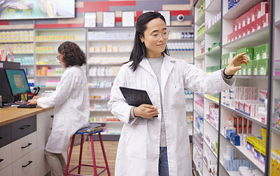 Buy stock photo Pharmacy, tablet and pharmacist woman for medicine management, stock research and inventory data app. Digital technology, retail logistics and asian healthcare doctor or person for product data check