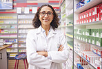 Pharmacy stock, medicine shelf and portrait of a woman pharmacist ready for work. Pharmaceutical store, retail inventory and healthcare drug shelves with a happy employee feeling proud of dispensary 