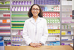 Pharmacy, pills and portrait of a woman pharmacist ready for customer service. Pharmaceutical store, medicine inventory and healthcare drug shelves with a happy employee feeling proud of dispensary 