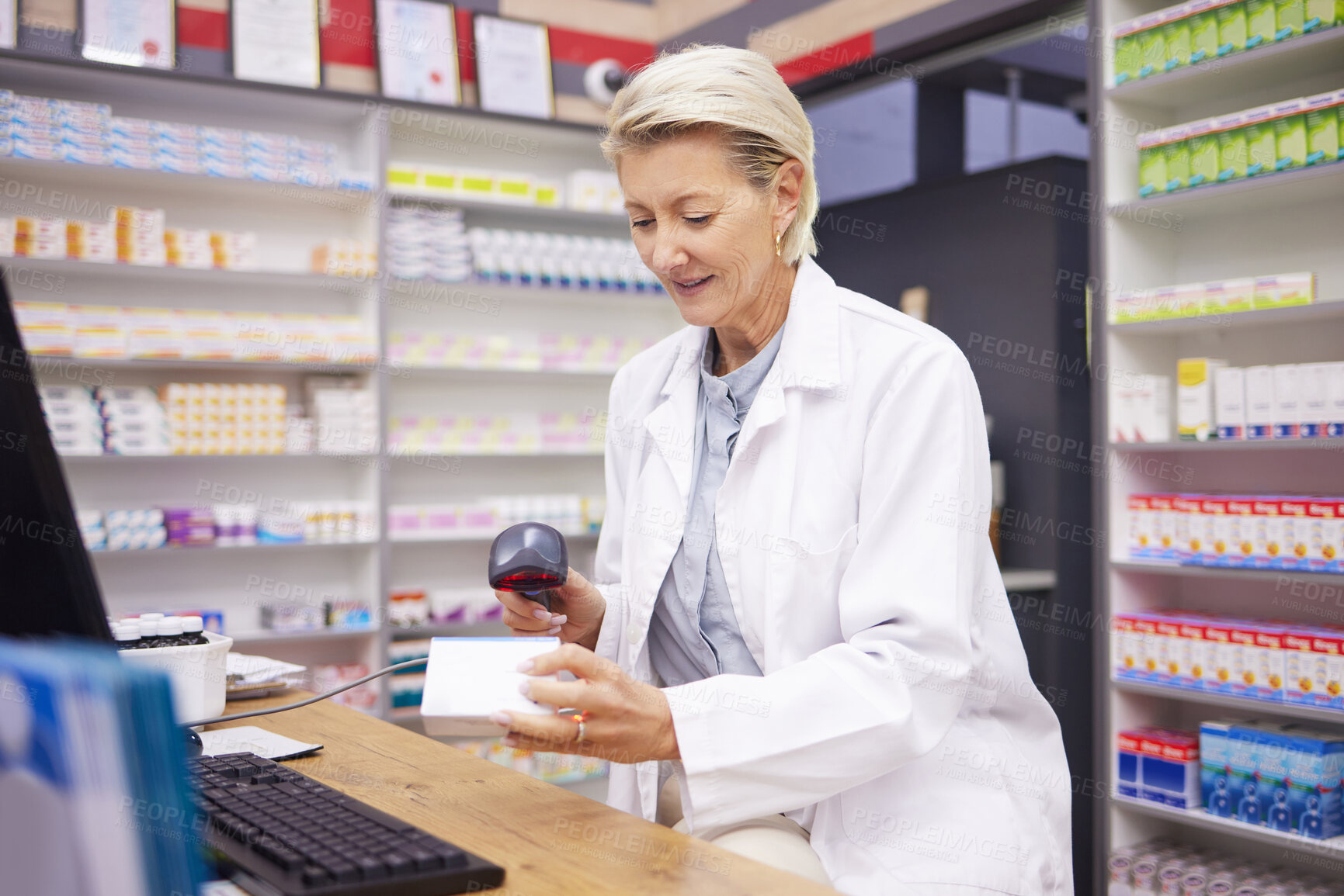 Buy stock photo Pharmacy, smile and woman scanning medicine at checkout counter for prescription drugs. Healthcare, pills and certified senior pharmacist with medical product in box and digital scanner in drugstore.