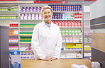 Pharmacy, smile and portrait of woman at counter in drugstore, happy customer service and advice in medicine. Prescription drugs, pharmacist and inventory of pills and medicine at checkout in store.