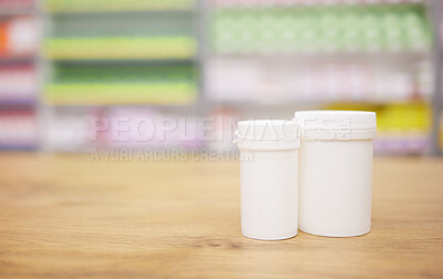 Buy stock photo Pharmacy, medicine and mockup with a tablet containers for pills on a wooden countertop for treatment. Medical, insurance and healthcare in a drugstore with mock up for pharmaceutical advertising