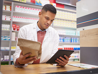 Buy stock photo Pharmacy, tablet and pharmacist doing research on medication on the internet in a clinic. Healthcare, medical and male doctor or chemist reading information on prescription medicine on mobile device.