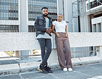 Date, urban and portrait of an African couple in the city for fashion, weekend fun and vacation. Fashionable, serious and black man and woman standing on a bridge for bonding and time in South Africa