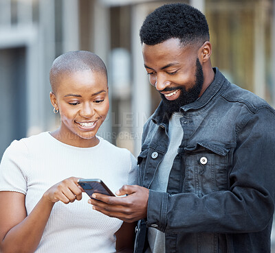 Buy stock photo City, communication and couple browsing on a cellphone with social media, mobile app or the internet. Technology, 5g network and young African man and woman scrolling on a website with phone in town.
