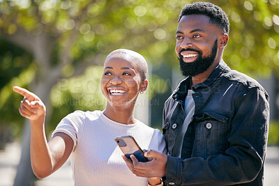 Buy stock photo Happy, phone and pointing with black couple in city for directions, travel and summer date. Smile, love and bonding with man and woman in urban town for technology, social and happiness together