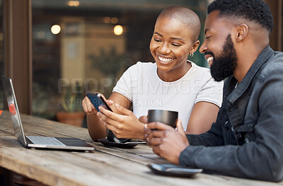 Buy stock photo Cafe, social media and dating with a black couple laughing together at a table in a restaurant. Humor, love or date with a man and woman looking at a meme on a phone while bonding in a coffee shop