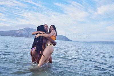 Buy stock photo Sea, mockup and woman friends hugging outdoor together in nature during summer vacation or holiday. Beach, water or sky with a female friend group wet in the ocean during a hug for happy bonding