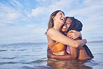 Love, women and couple in ocean, hug and summer vacation with break, celebration and Valetines day. Romance, friends and females on seaside holiday, romantic and loving together, bonding or happiness