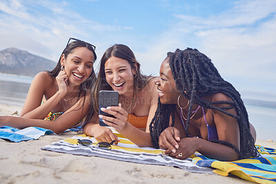 Buy stock photo Girl friends, ocean fun and phone of a teenager laughing at funny meme by the sea in Miami. Travel, vacation and sunshine with happy students enjoying spring break with mobile app lying on sand 