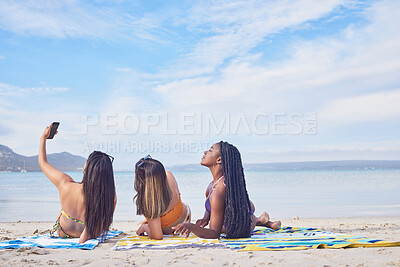 Buy stock photo Selfie, relax and women on the beach for a vacation, summer travel and social media update. Peace, fun and back of friends taking a photo on a holiday at the sea while live streaming on the sand