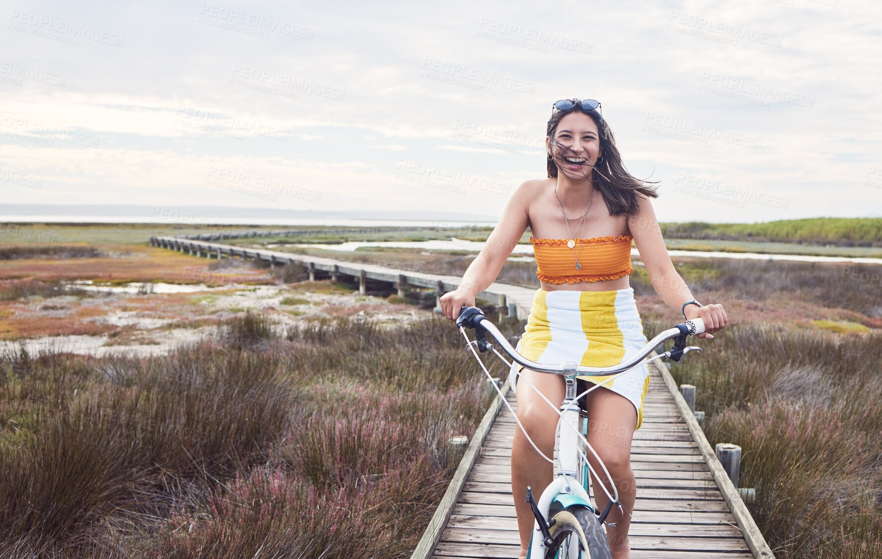 Buy stock photo Portrait, bike and mockup with a woman cycling outdoor in nature for freedom, fun or adventure in the countryside. Happy, smile and bicycle with a female cyclist outside in the wilderness for travel