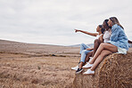 View, showing and women in nature for a holiday, freedom and bonding in the countryside. Break, happy and friends pointing while watching on a village field during a vacation or road trip in Italy