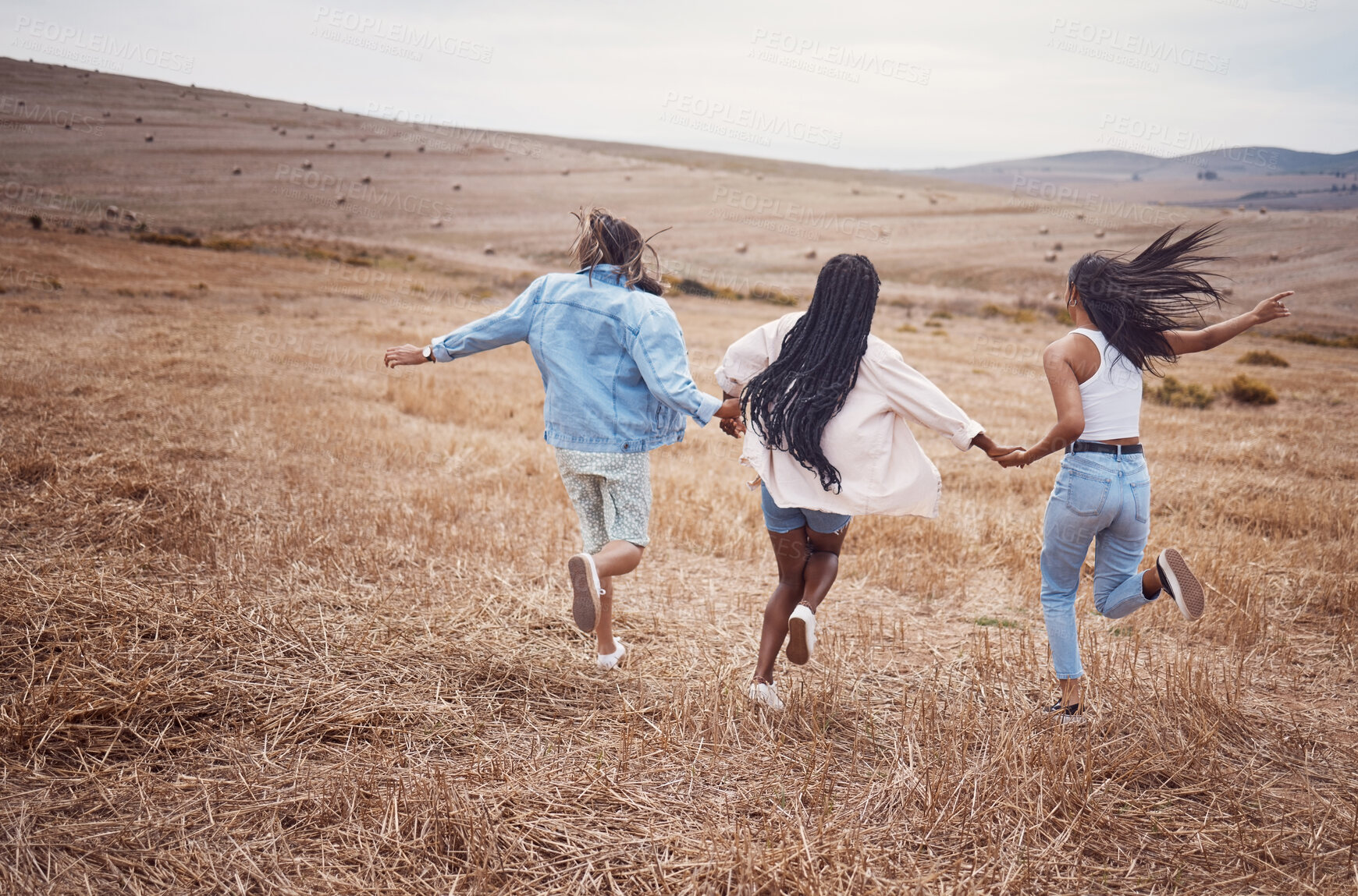 Buy stock photo Freedom, nature and run with woman friends together outdoor for adventure, fun or exploring the wilderness. Running, autumn and excited with a friend group playing outside while bonding from the back