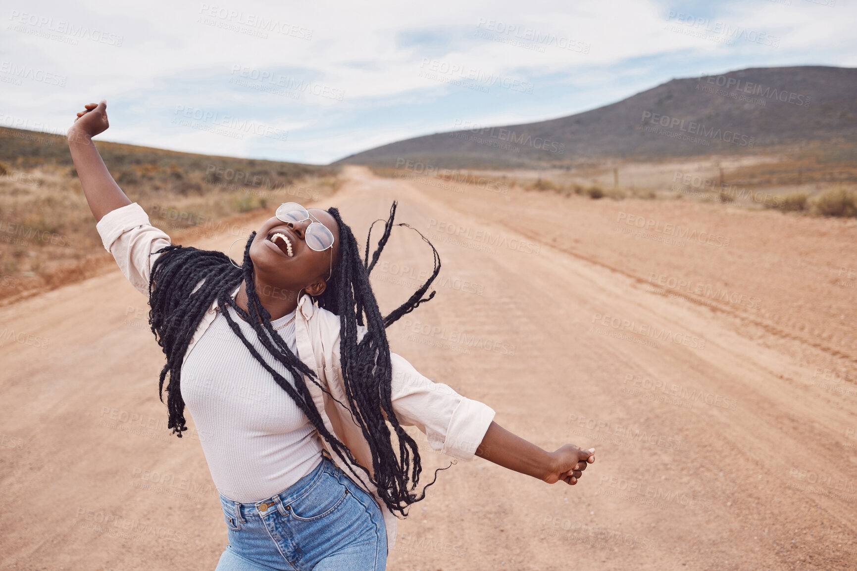 Buy stock photo Freedom, excitement and mockup with a black woman dancing in the desert for fun during a road trip. Travel, dance and mock up with a person enjoying a holiday or vacation in nature to celebrate life