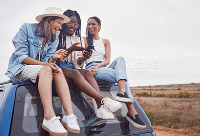 Buy stock photo Car, road trip and happy friends with phone, social media post and countryside adventure on sky mockup space. South Africa group or diversity women. 5g smartphone and roof for travel journey together