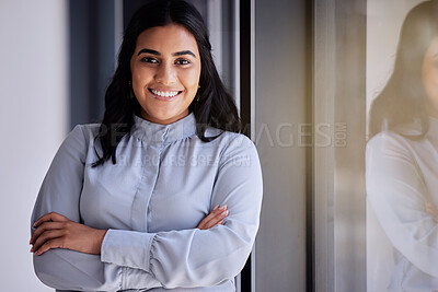 Buy stock photo Portrait, window and vision with a business woman in the office, standing arms crossed for growth. Mission, motivation and smile with a happy female employee at work for corporate company success