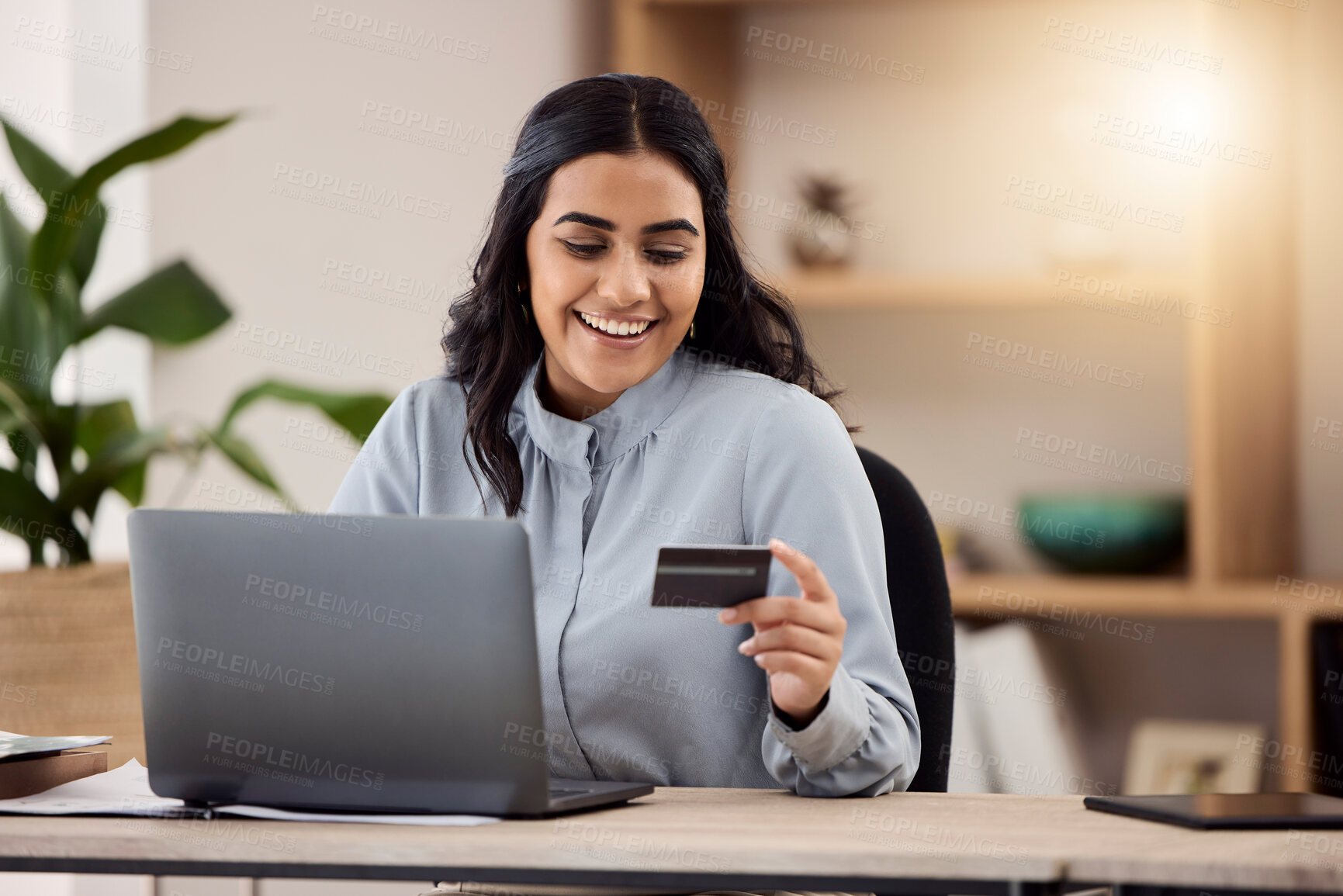 Buy stock photo Credit card, laptop and happy woman for online shopping, e commerce and payment on fintech in her office. Employee, indian person or worker on computer for internet banking, online investment or sale