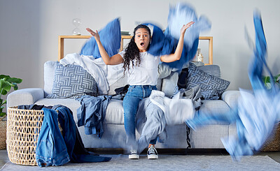 Buy stock photo Laundry, frustrated and upset woman in the living room throwing the clothes with anger at her home. Crazy, busy and angry female maid, housewife or cleaner with blur motion of dirty washing at house.