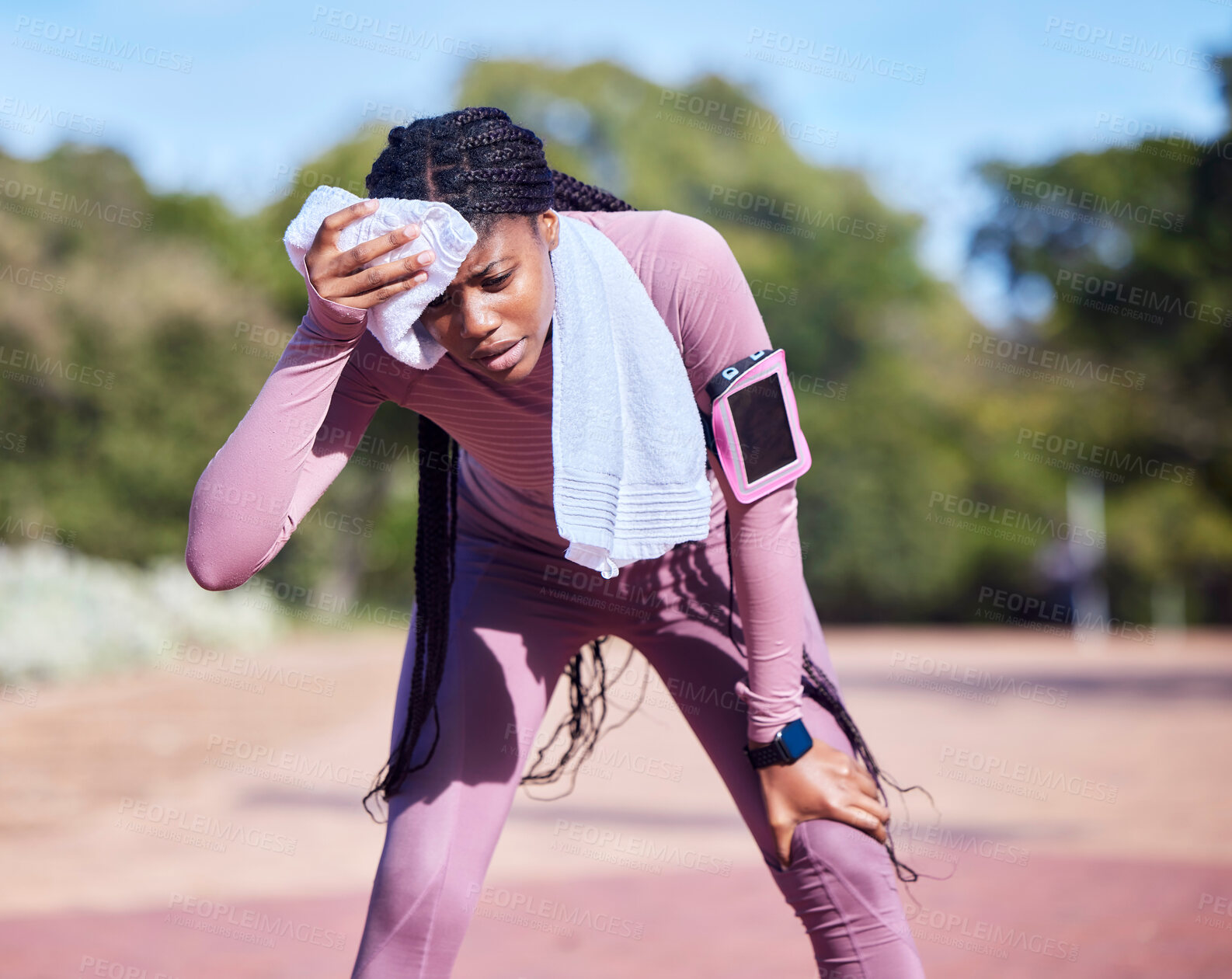Buy stock photo Sweat, exercise and black woman outdoor, tired and running for wellness, balance or cardio. African American female athlete, runner and lady with towel, rest or break after workout, training or relax